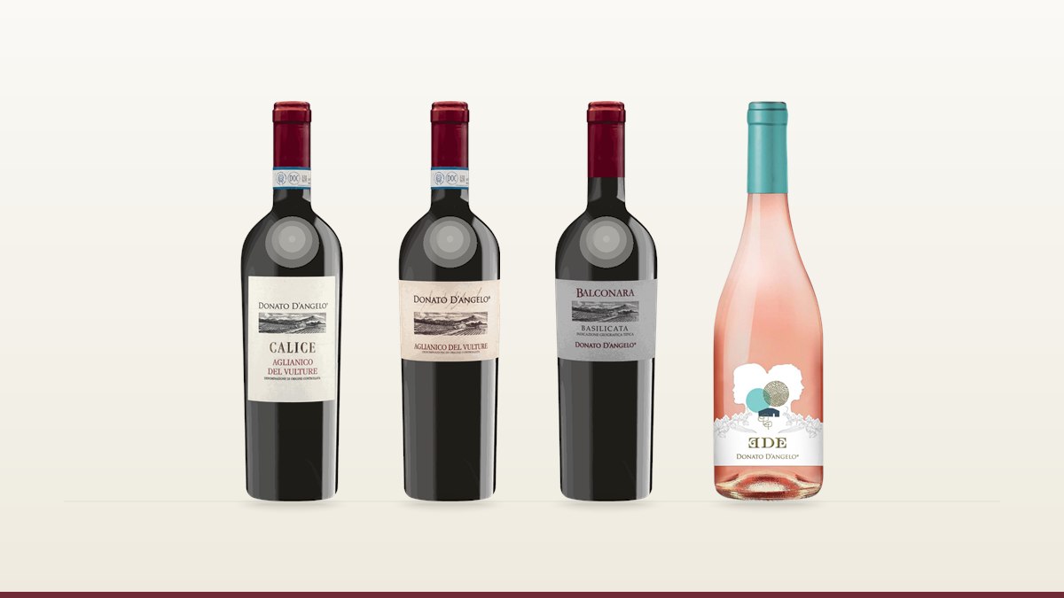 Four Donato d'Angelo bottles from Basilicata, two of them Aglianico del Vulture DOC, on cream